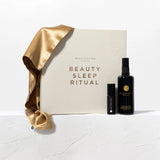 Beauty sleep ritual set with a satin cover and bottles on a white background
